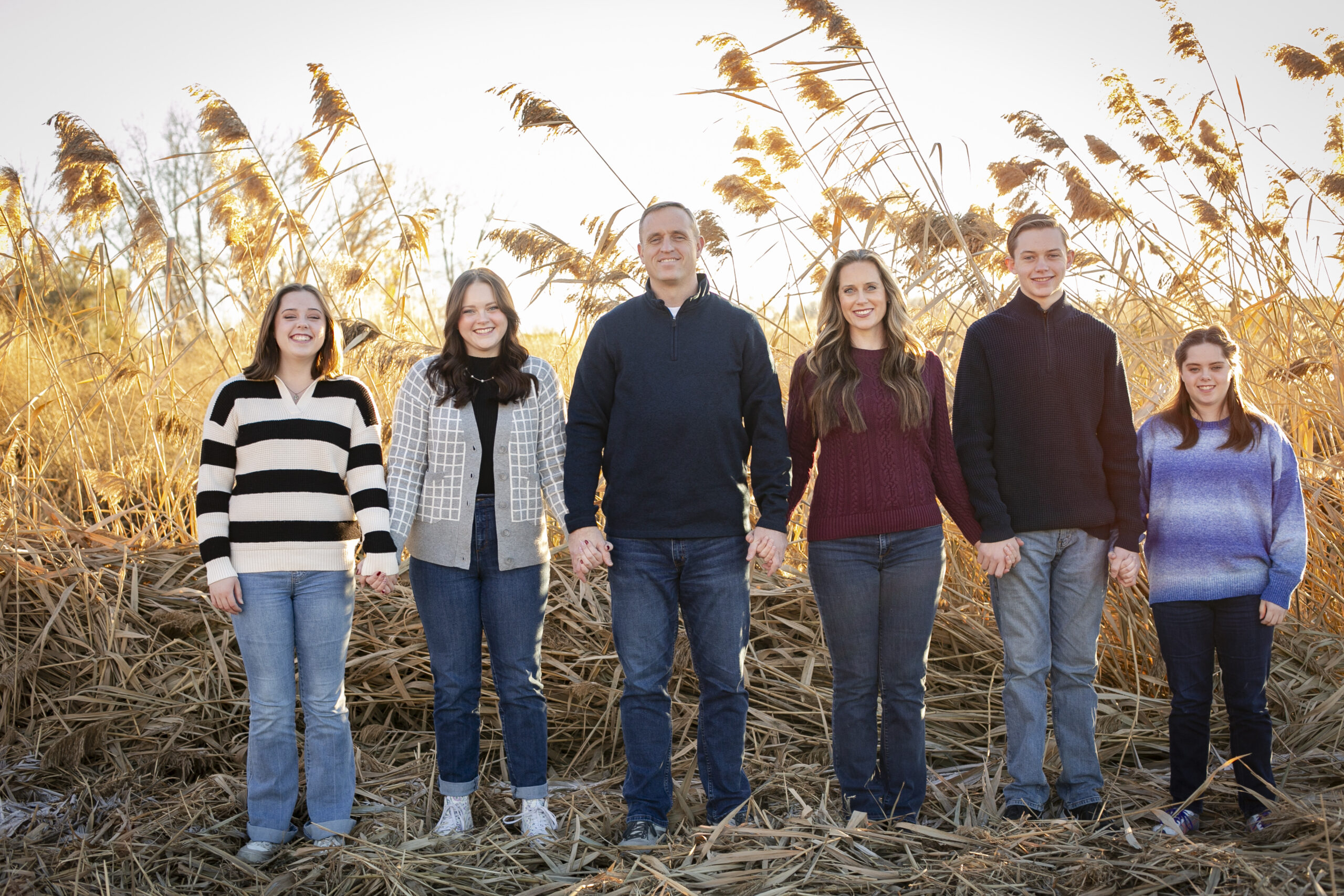 Picture of Karen and her family, beautiful mountains in the background